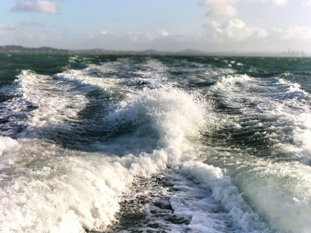turbulent waves behind a boat